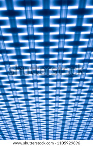 The contrast blue or purple geometric pattern background or texture. Square elements  and the lines in the white light. Abstract phote resemble the fabric structure