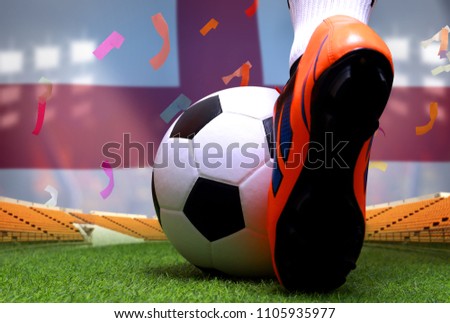 Close up legs and feet of soccer player or football player walk on green grass ready to play match on national England flag background.