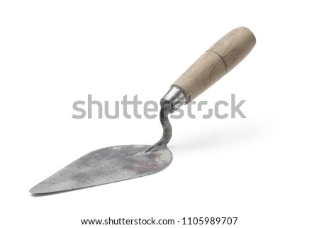 Old trowel on white background. Royalty-Free Stock Photo #1105989707