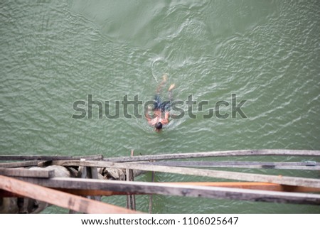 Boy swimming in the river