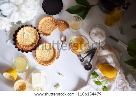 Homemade baking. Preparation of Tasty tartlets with lemon curd. Top view