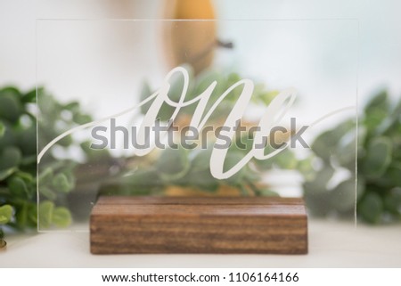 Table number. Fancy wedding table number one written out. Royalty-Free Stock Photo #1106164166