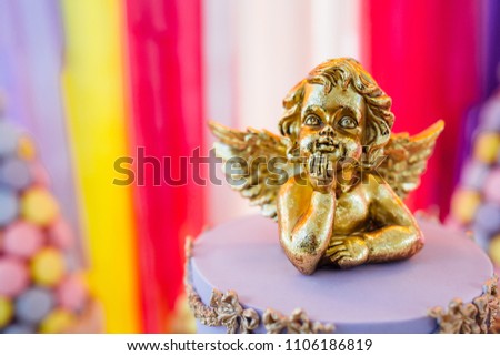 A very beautiful cake is decorated with angels. Close up picture