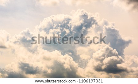 Clouds, close up view on a fluffy cumulus before storm. Background