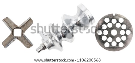 Spare parts for meat grinder: feed screw grinder knives and grate for meat grinder isolated on white background