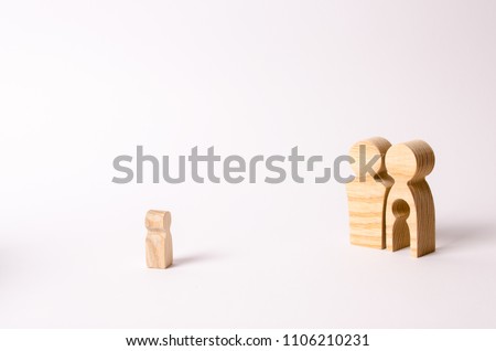 Wooden figurines of parents look at a lonely child. An orphan child is looking for a family. A barren couple adopts abandoned children. Loss of a single child. Medical problems. couple wants a baby.