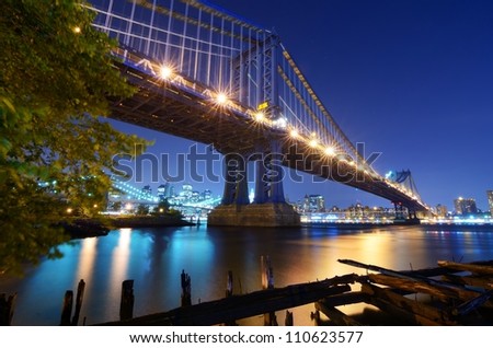 The Manhattan Bridge Spans the East River from the borough of Brooklyn to the borough of Manhattan in the city of New York, New York, USA. Brooklyn Bridge is visible in the distance.