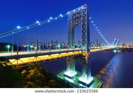 The George Washington Bridge spans the Hudson River from Fort Lee, New Jersey to the Washington Heights neighborhood in the borough of Manhattan in the city of New York, New York.