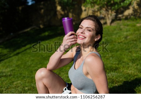Young sporty woman working out at the park
