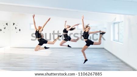 The group of beautiful girls practicing modern ballet dance.  Royalty-Free Stock Photo #1106267885