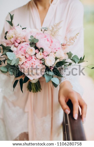 Wedding bouquet of peony on green background