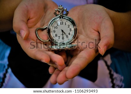 Pocket watch in girl dress hand