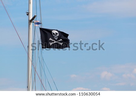 Pirates skull and crossed bones flag flying.