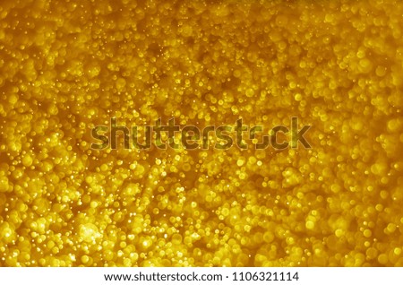 abstract yellow gold bokeh glitter sparkle background.
