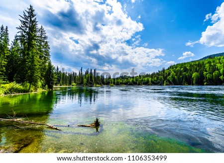 Clearwater Lake in Wells Gray Provincial Park, British Columbia, Canada . The lake is high up in the Cariboo Mountains and feeds the Clearwater River and then the Thompson River Royalty-Free Stock Photo #1106353499