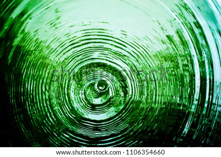 Top view Closeup green water rings, Circle reflections in pool. Royalty-Free Stock Photo #1106354660
