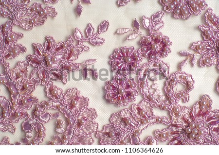 Texture, background, pattern.  Luxury 3D Beaded lace fabric, hand made Pink pearl beads 3D flowers, pink French Embroidered lace, Beads Wedding Lace Royalty-Free Stock Photo #1106364626