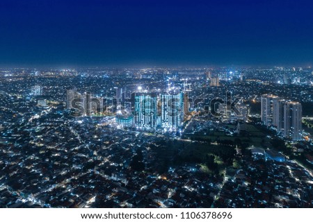 Aerial View of Cityscape at Night with Vibrant Lights Jakarta, West Java, Indonesia, Asia
