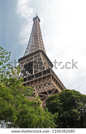 Unique shot of the iconic Eiffel Tower in Paris during the day.