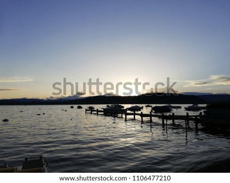 Footbridge and twilight on lake Murten