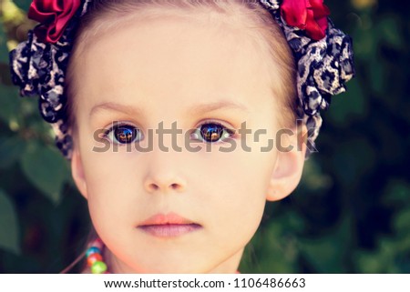 The girl's portrait with big brown eyes
