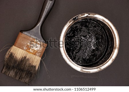 A studio photo of black paint