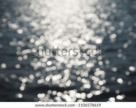 Blur bokeh photography of sunlight reflect on the sea