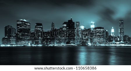 Manhattan skyline by night from Brooklyn bridge park - USA