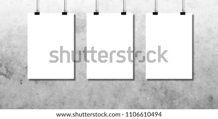 
White paper or poster on the concrete wall background in the room.