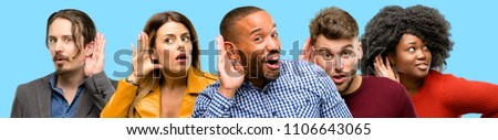 Group of mixed people, women and men holding hand near ear trying to listen to interesting news expressing communication concept and gossip Royalty-Free Stock Photo #1106643065