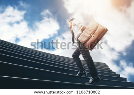 Successful businessman running fast upstairs Success concept Royalty-Free Stock Photo #1106710802