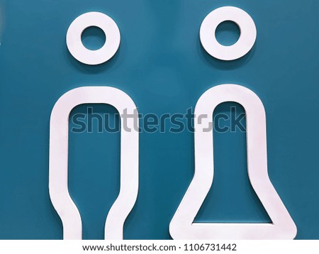 White Toilet Symbol of Men and Women on Blue Background