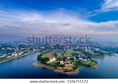 Aerial View of Cape, Bay, and Islets Landscape on the Blue Water with Blue Sky, Bandung, West Java, Indonesia, Asia
