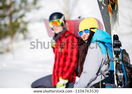 Photo of sports men and women with mountain skis walking on snow hill
