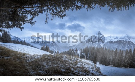 Winter landscape, framed mountains in Switzerland. Taken a 5-minute walk from Latsch (Bergün). High resolution, 34 megapixels. Royalty-Free Stock Photo #1106765600