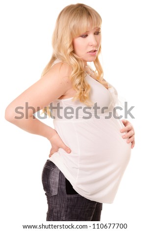 Pregnant woman feels discomfort in back, isolated on white background