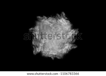 Black powder explosion on white background.dust explode. Paint Holi.