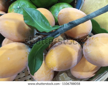 A sweet sweet mango in a basket
