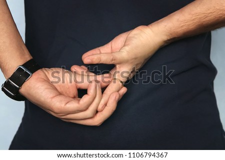 Man is taking off the wedding ring. concept of treason. Husband cheats on wife. cheating wife Royalty-Free Stock Photo #1106794367