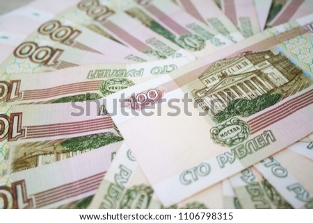 business, finance, saving, banking and people concept - close up bundle of money Russian Banknotes one hundred rubles