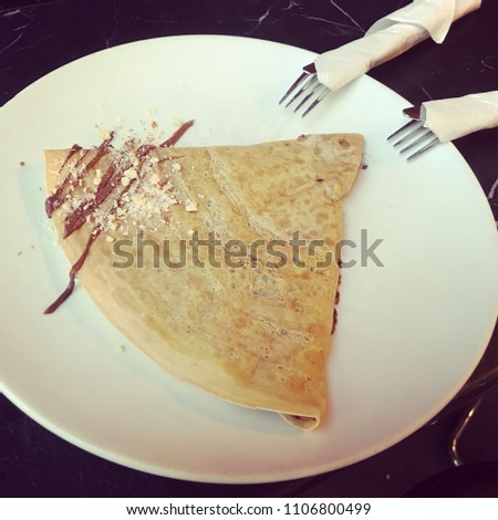 Crepe with two culinary tools
