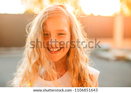 Happy child outdoors. Portrait one girl. Smiling child 