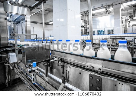 Milk production at factory Royalty-Free Stock Photo #1106870432