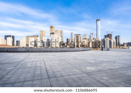 empty square floor with city skyline