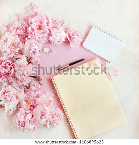 flat lay concept with writing pad, pen, coffee and beautiful peonies, can be used as background 