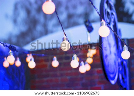 A garland of lanterns hangs in the street