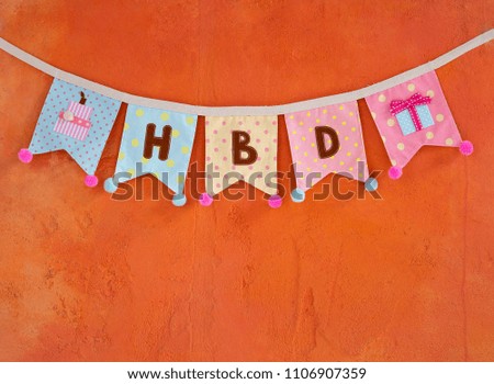 Design Birthday party flag hanging on orange cement wall texture background