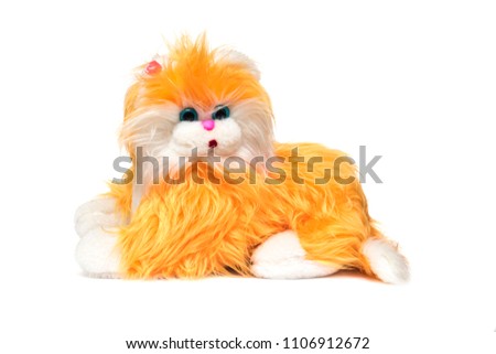 Soft toy cute orange cat on a white background, isolate