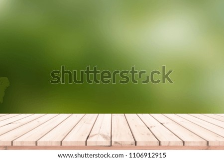 Wood plank with abstract green blurred background for product display