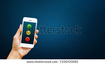 Hand of client select satisfaction on smart phone. Service rating, satisfaction, customer experience concept
